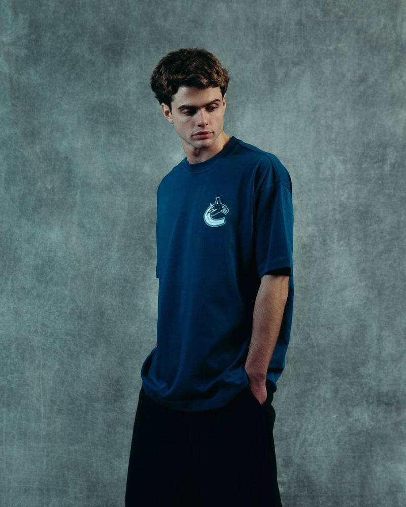 Model showcasing an In-House custom cotton T-shirt designed and manufactured for an emerging clothing brand.