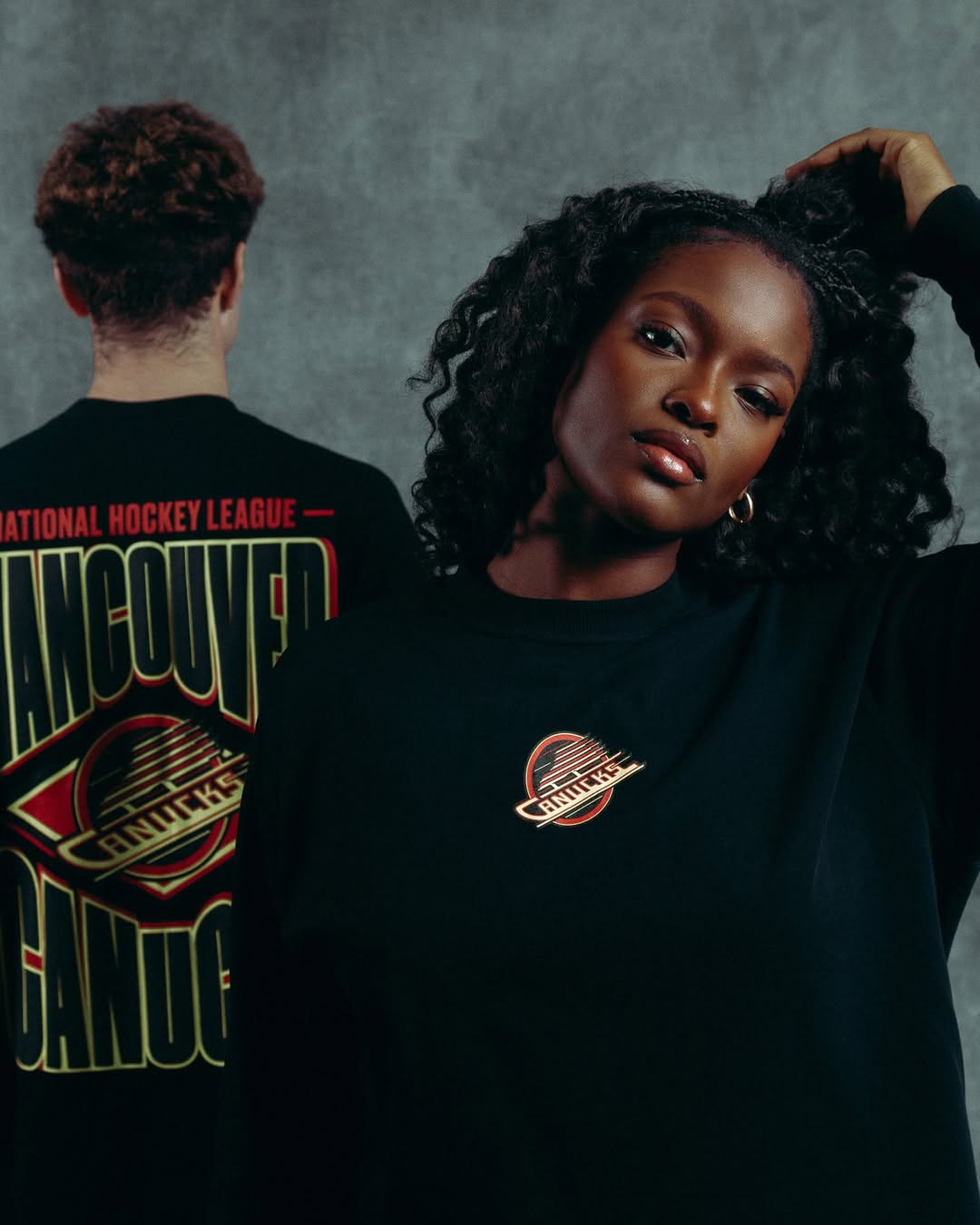 Model wearing a custom apparel piece from In-House, showcasing detailed patch placement and premium stitching.